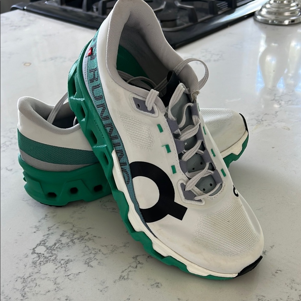 On Running White and Green Sneakers with Modern Design